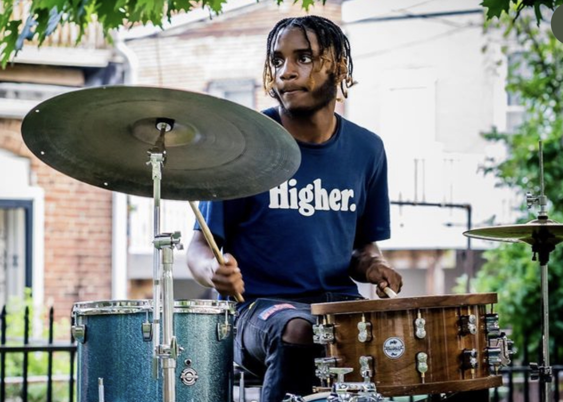 Devron Dennis, Co-Founder of the Right Direction Project, pictured playing the drumset.